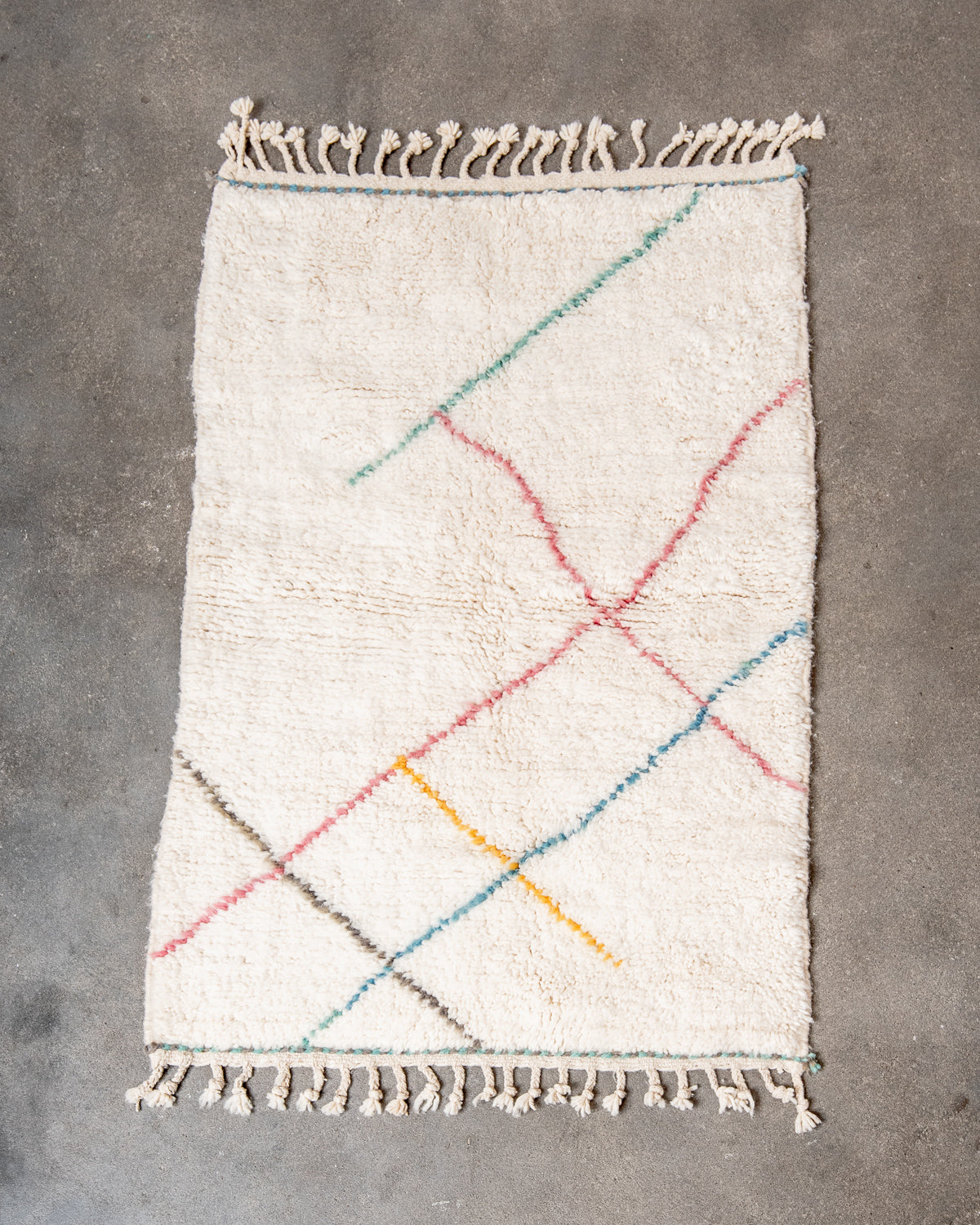 Modern, designer, handcrafted Berber rug from Morocco. Beniourain carpet with beautiful colours and patterns and fluffy wool texture.